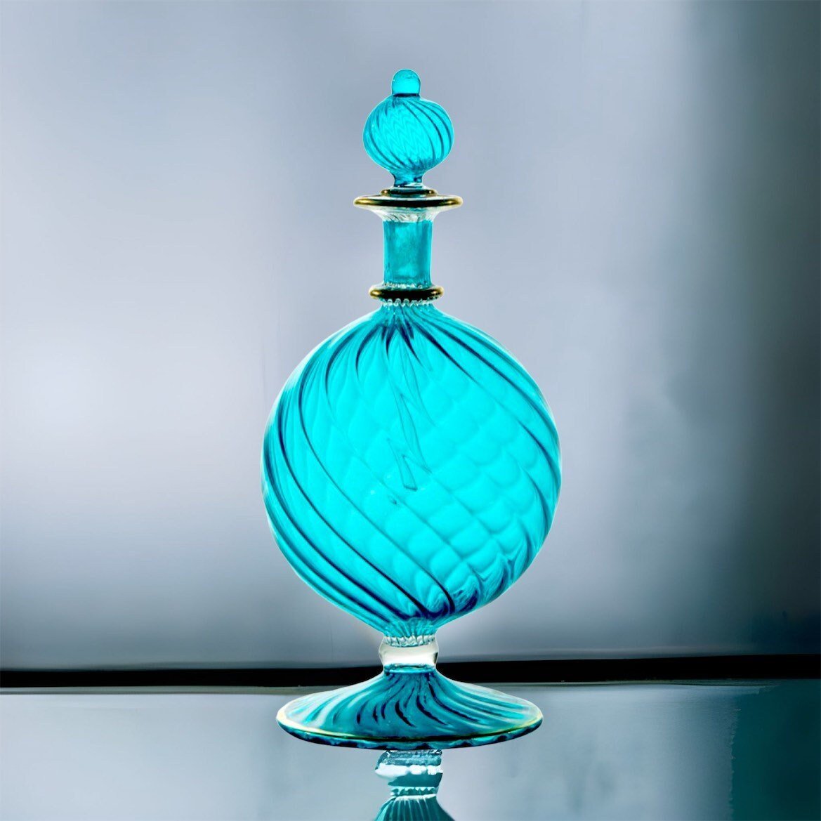 Hand-Blown Blue Glass Perfume Bottle with Swirled Design โ Decorative Art Glass Piece | Les Trois Pyramides