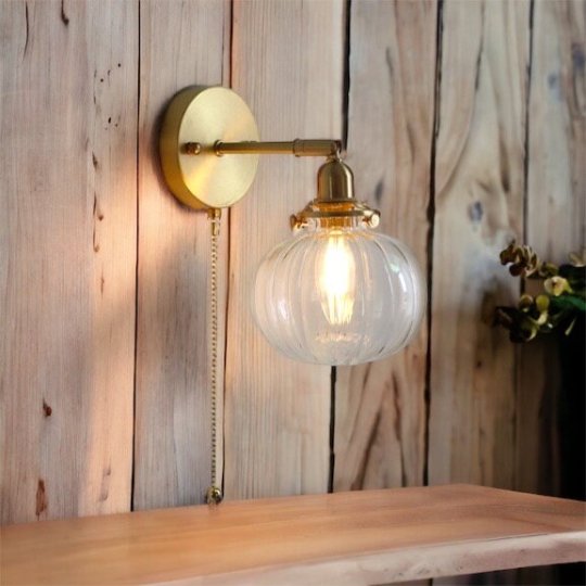 Vintage Brass Wall Sconce with Handblown Ribbed Glass Shade - Elegant Pull Chain Light Fixture for Bedroom or Living Room | Les Trois Pyramides