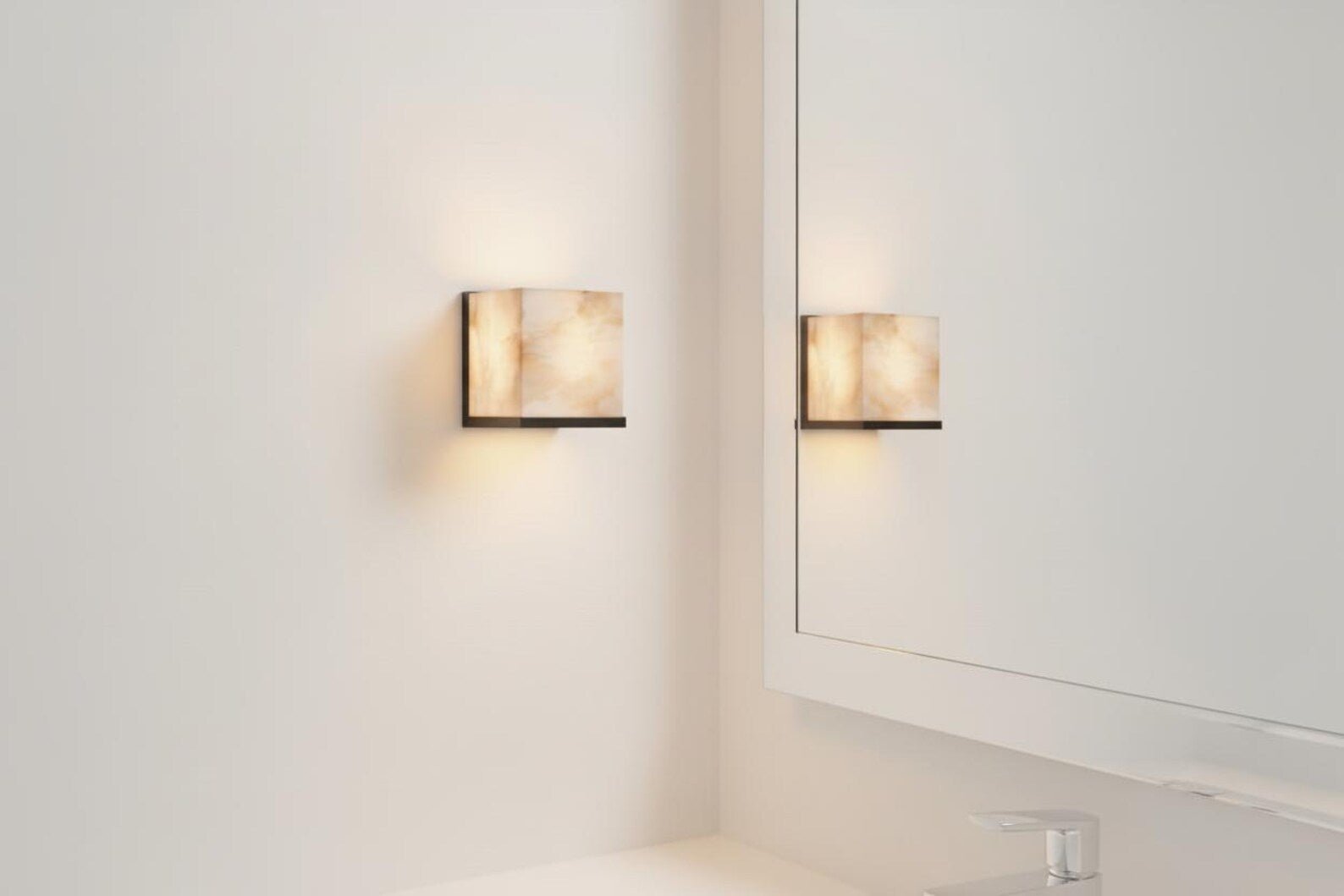 Two wall-mounted lights on a white wall with a mirror reflection.