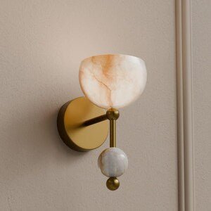 Wall-mounted light fixture with marble-like shade on a beige wall