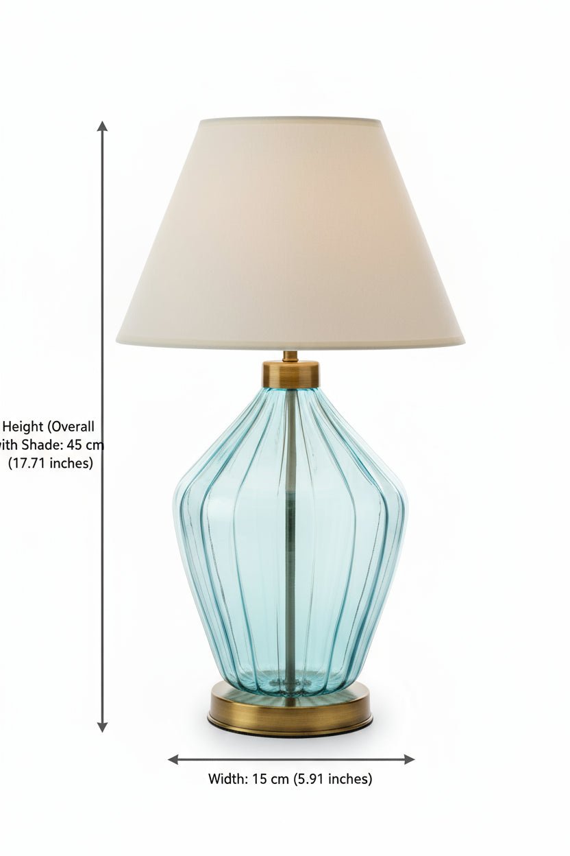 Table lamp with a blue glass base and beige lampshade on a white  background | Les Trois Pyramides