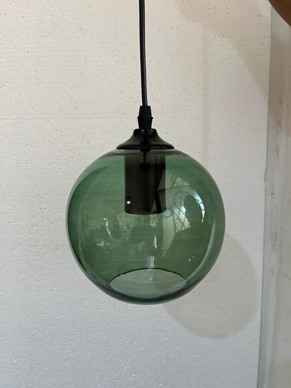 Set of three blown glass light pendants for kitchen decor | Les Trois Pyramides.
