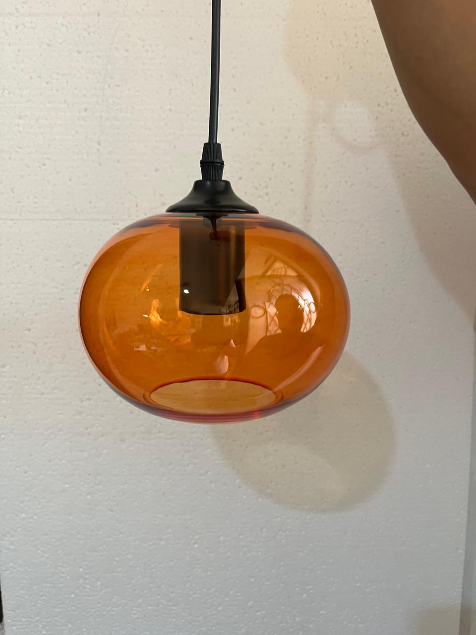 Set of three blown glass light pendants for kitchen decor | Les Trois Pyramides.
