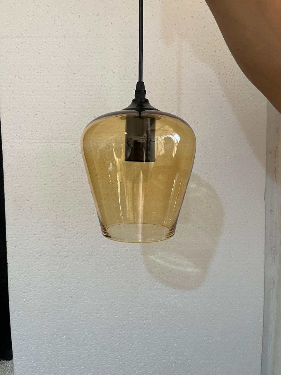 Set of three blown glass light pendants for kitchen decor | Les Trois Pyramides.
