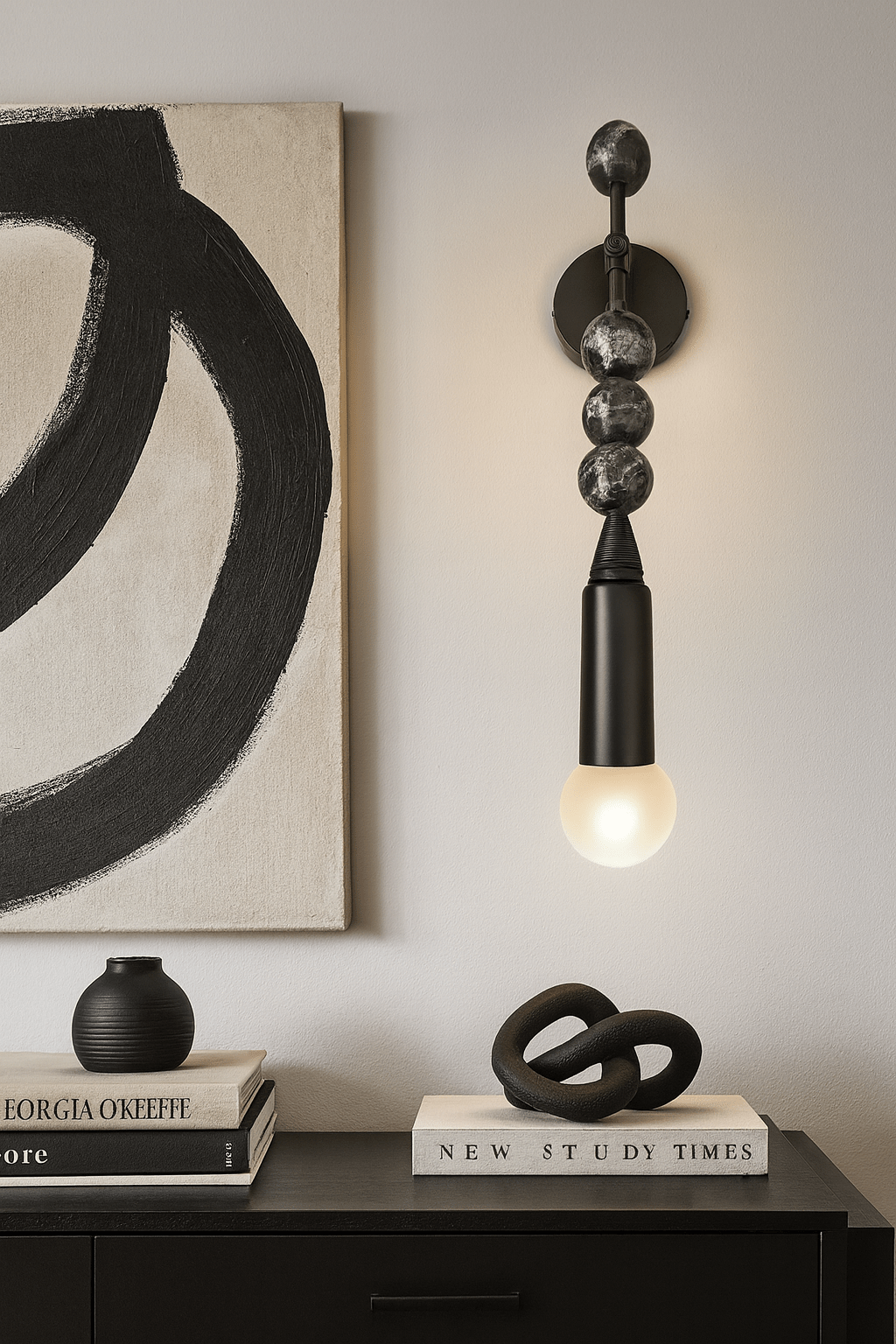 Modern wall sconce with black marble stones | Les Trois Pyramides