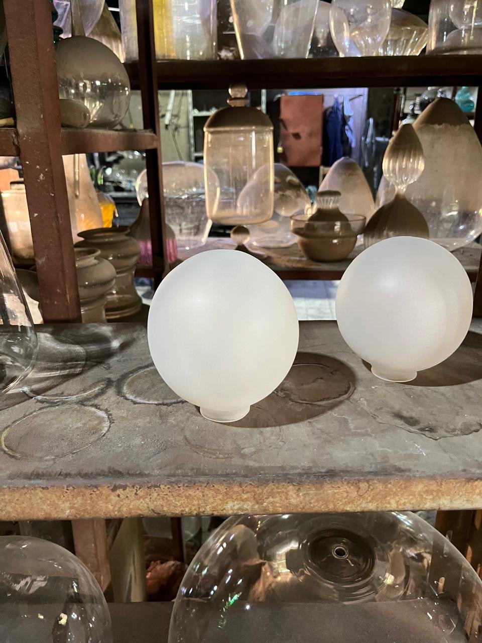  glass globes in workshop | Les Trois Pyramides