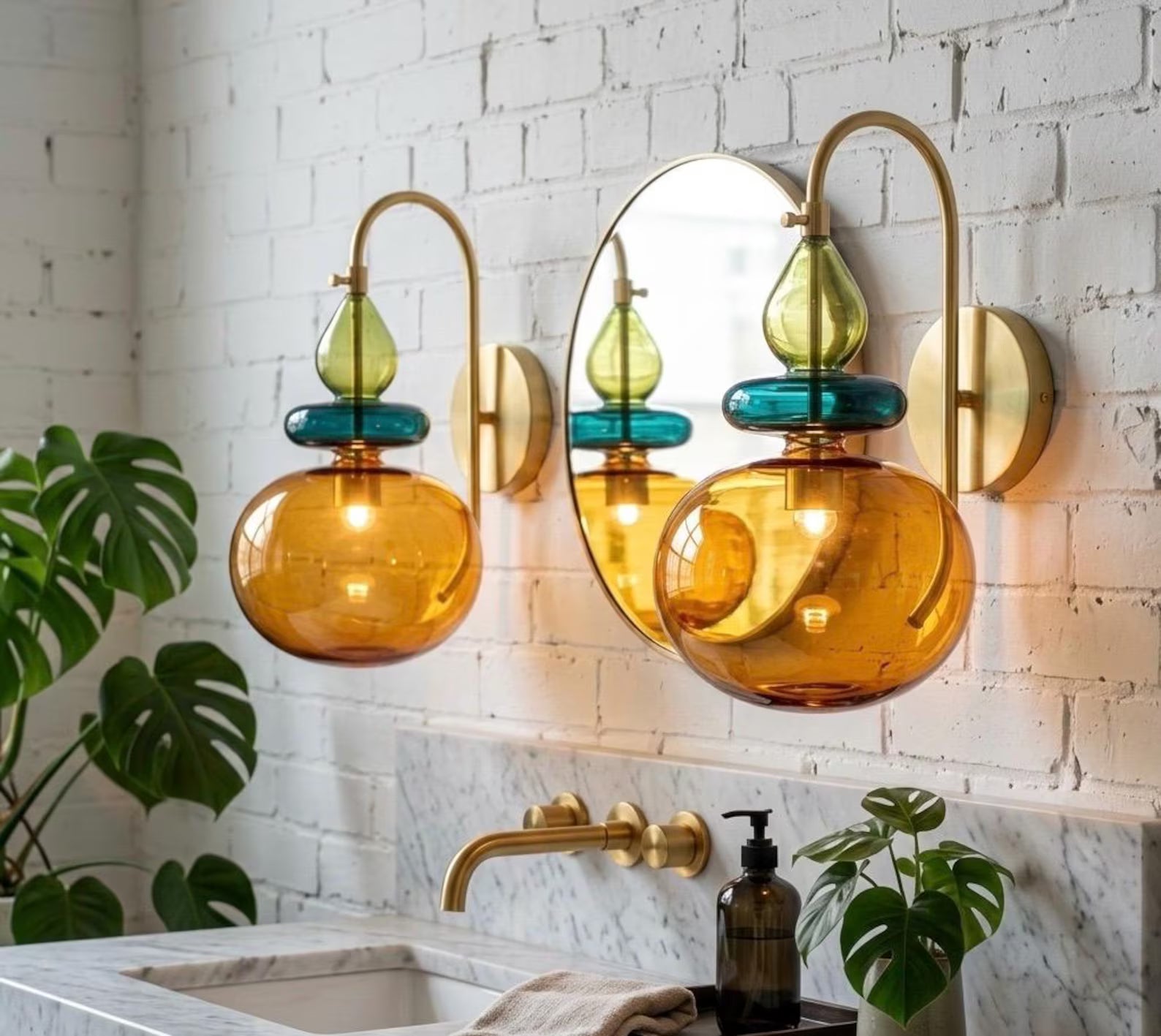 Modern bathroom with colorful glass wall sconces, sink, and plants.