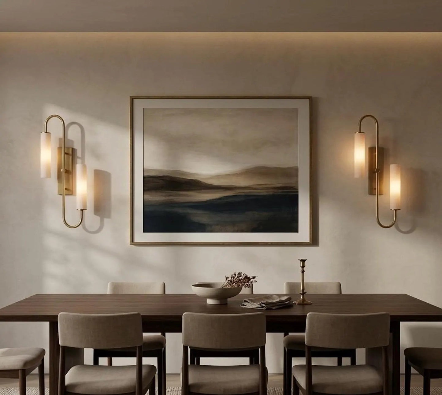 Dining room with a wooden table, chairs, wall art, and wall sconces.