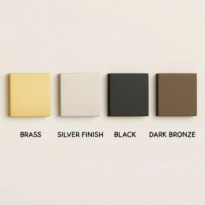 Four square metal samples in brass, silver finish, black, and dark bronze on a beige background.