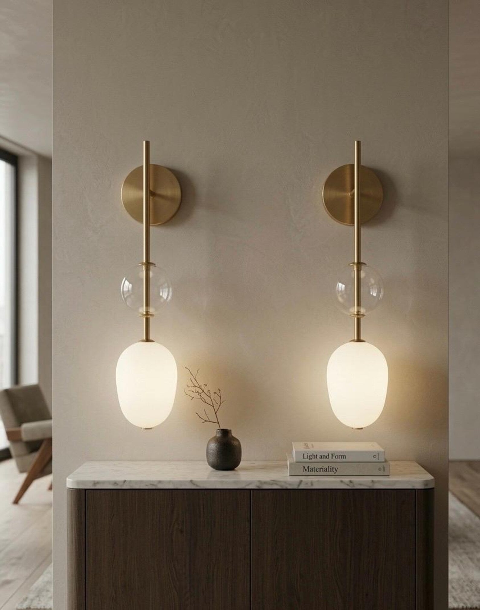 Two wall-mounted lights with glass shades in a modern interior setting.