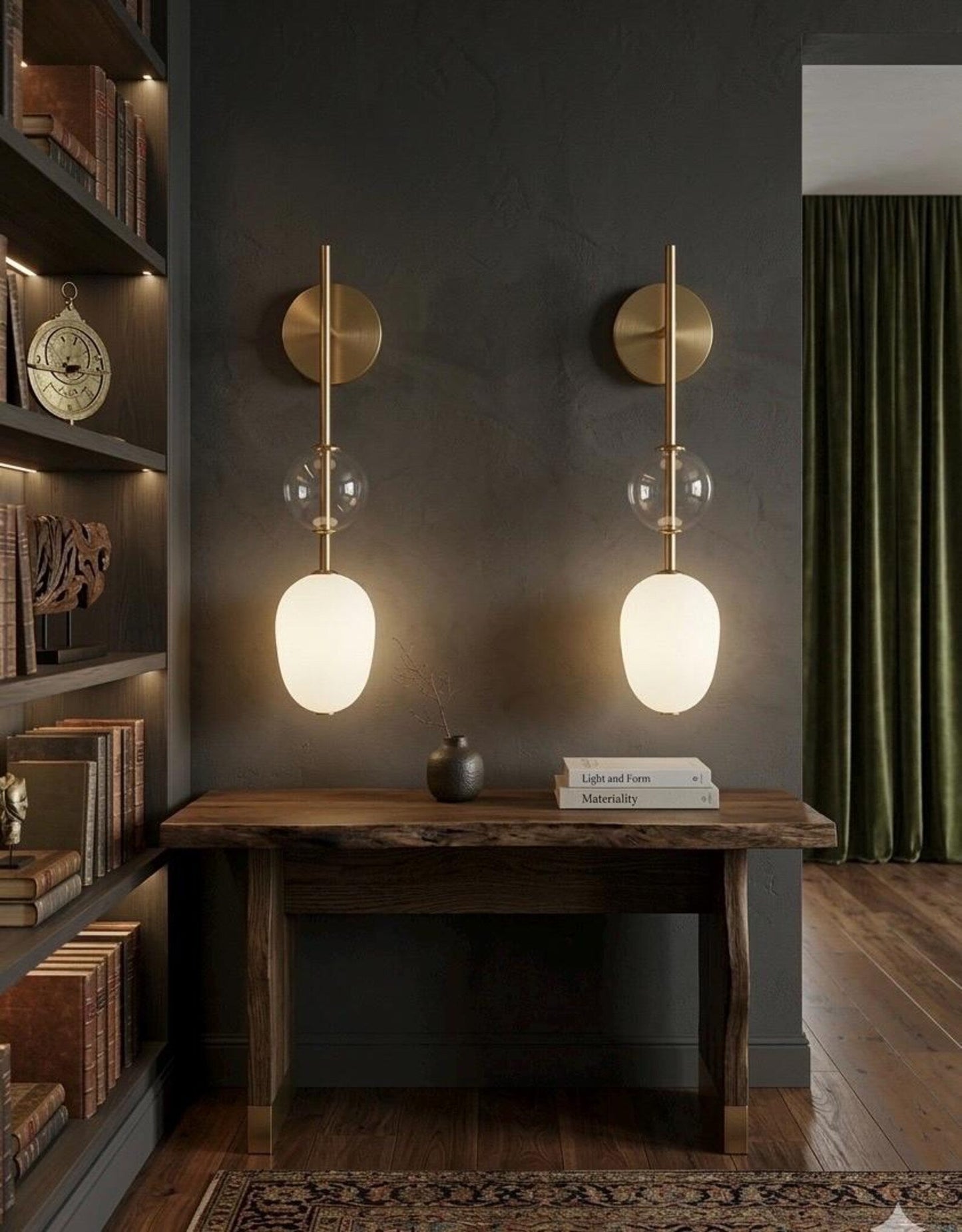 Modern wall sconces with glass shades in a home office setting.