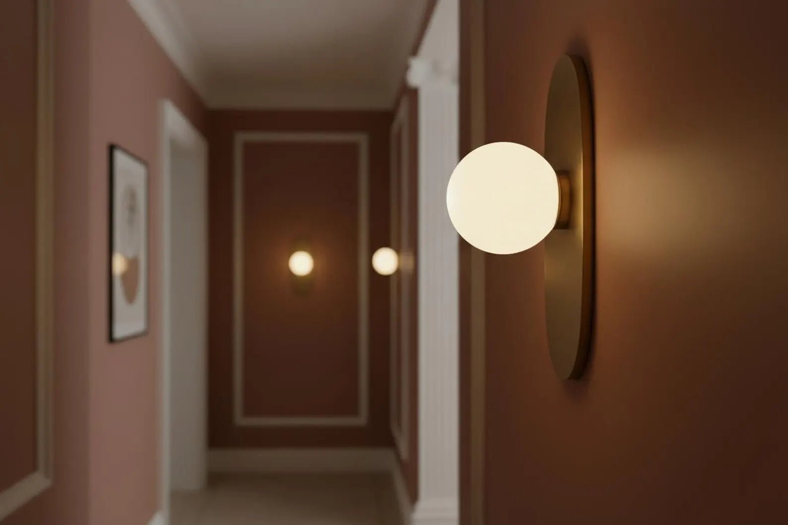Modern wall sconce in a hallway with warm lighting