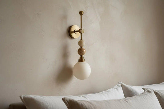 Wall-mounted lamp with a beige and gold design 