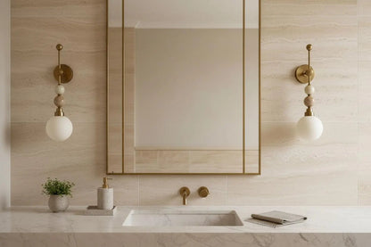 Bathroom with a mirror, sink, and decorative wall lights.