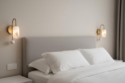 Neatly made bed with white bedding and pillows in a bedroom setting.