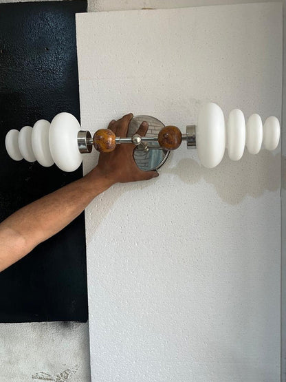 Double brass wall sconce with frosted glass shades and onyx stone details