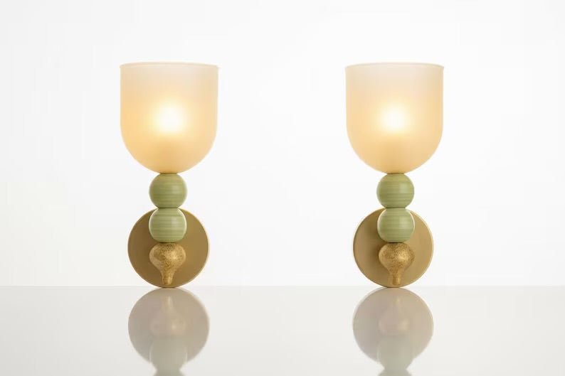 Front view of double onyx stone wall sconces with frosted glass shades
