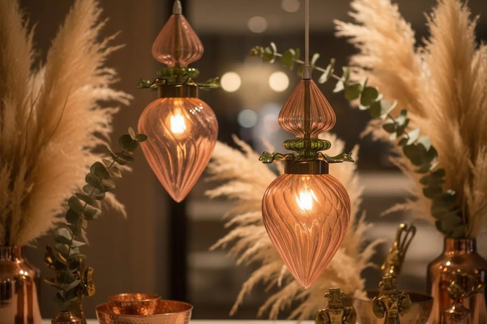 Decorative glass lights with pampas grass and eucalyptus in a warm setting