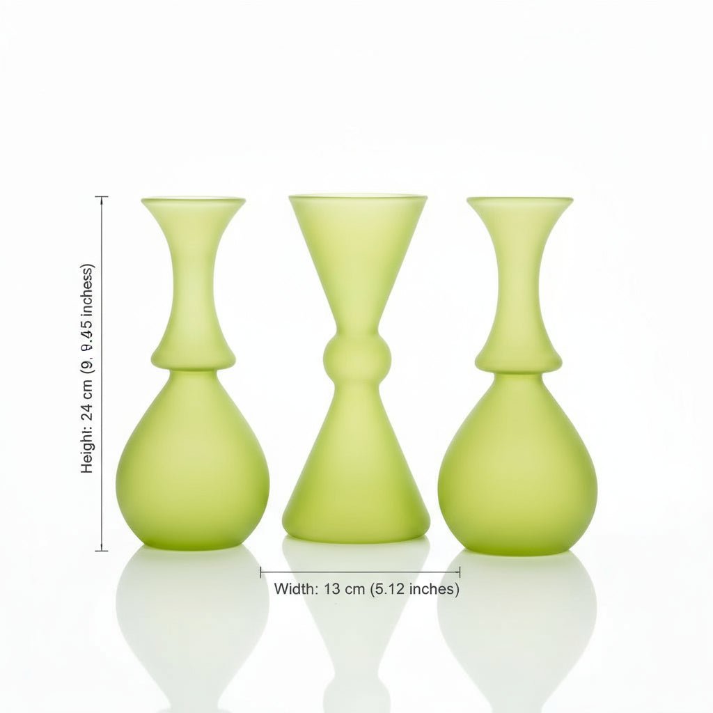 Three frosted green vases of different shapes on a white background