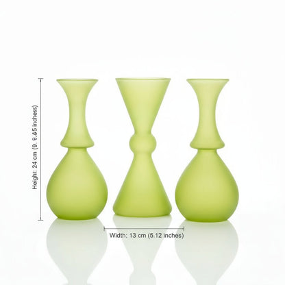 Three frosted green vases of different shapes on a white background