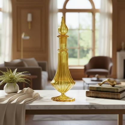 Decorative yellow decanter on a marble table in a living room setting