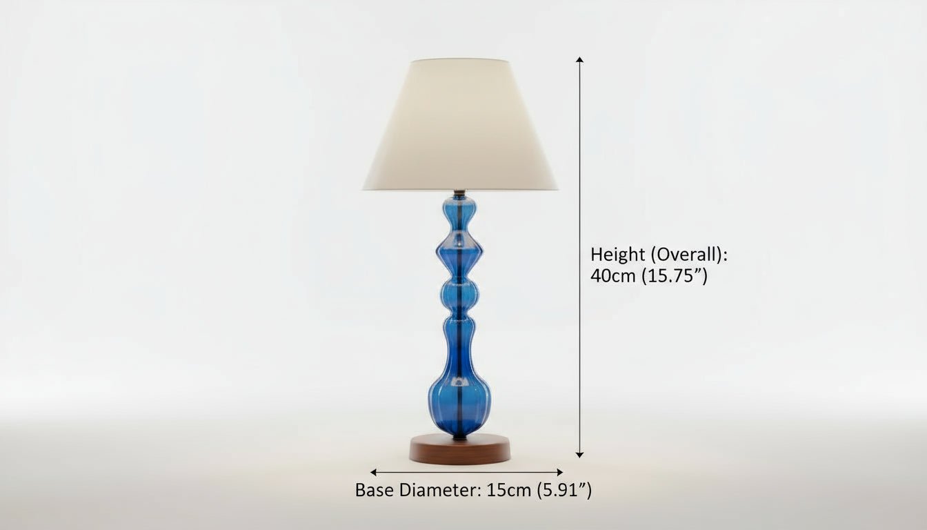 Table lamp with a blue base and beige shade on a white background