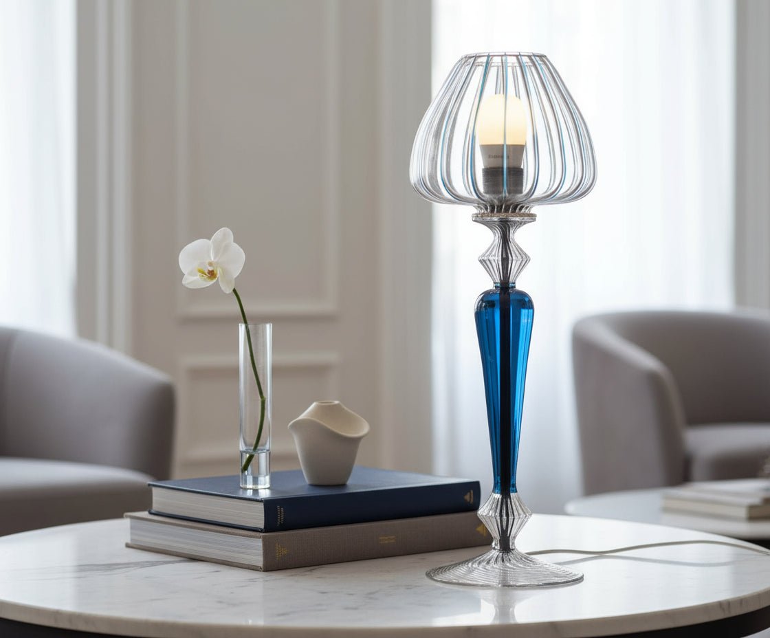 Decorative table lamp with blue and clear glass design on a white background