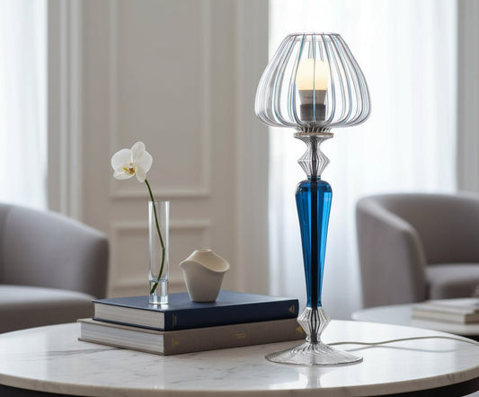 Decorative table lamp with blue and clear glass design on a white background