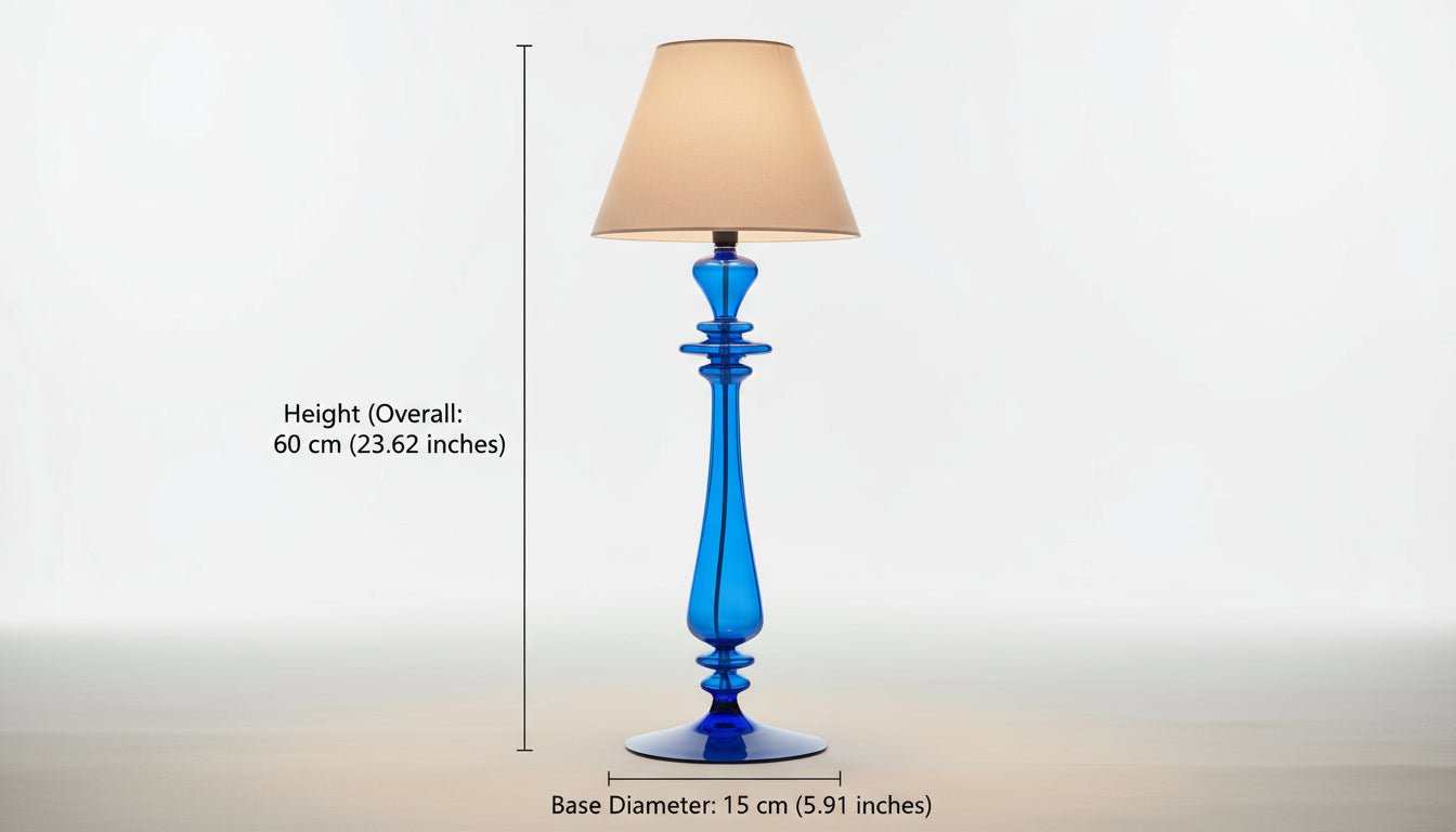 Blue glass table lamp with a beige lampshade on a light background