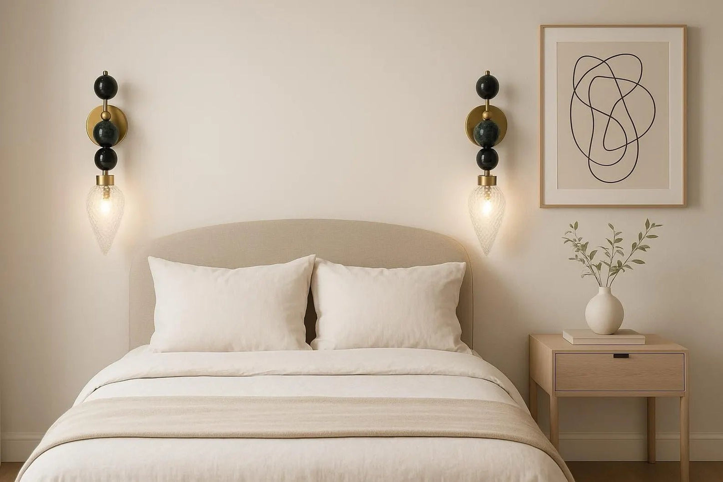 Neatly made bed with white bedding in a bedroom setting.