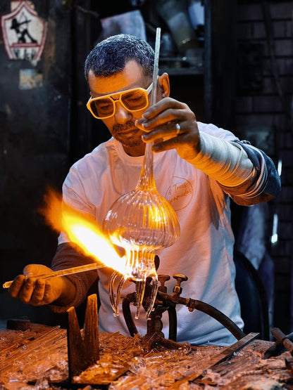Handmade blown glass lighting crafted by artisan in workshop