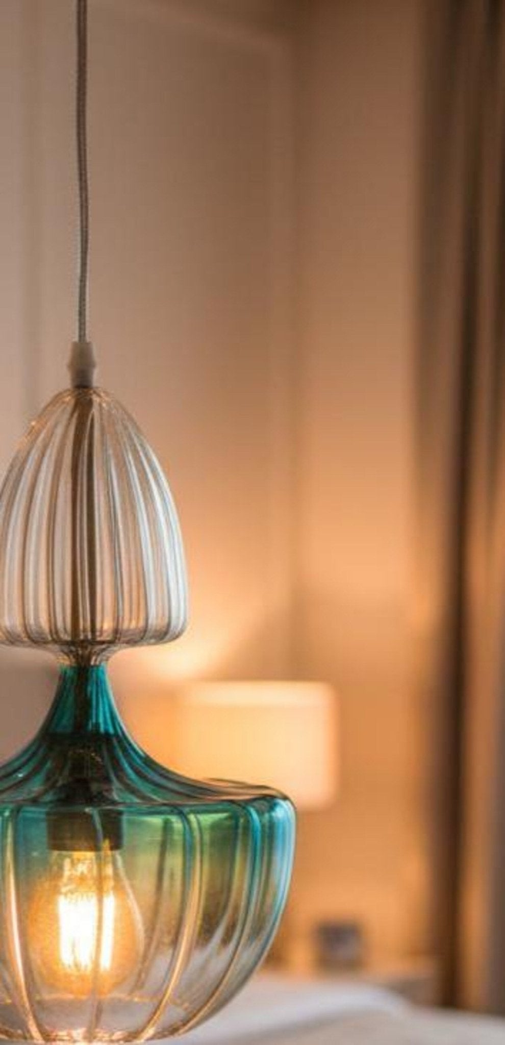 Close-up of a turquoise Blown Glass Pendant Light | Modern Hanging Lamp | Les Trois Pyramides.
