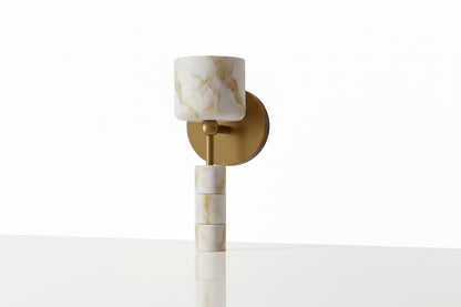 Front view of handmade alabaster wall sconce with solid brass wall plate and stone shade
