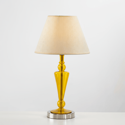Table lamp with a yellow base and beige shade on a white background | Les Trois pyramides