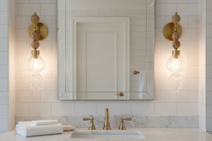 Artistic jellyfish wall sconce used as statement bathroom lighting
