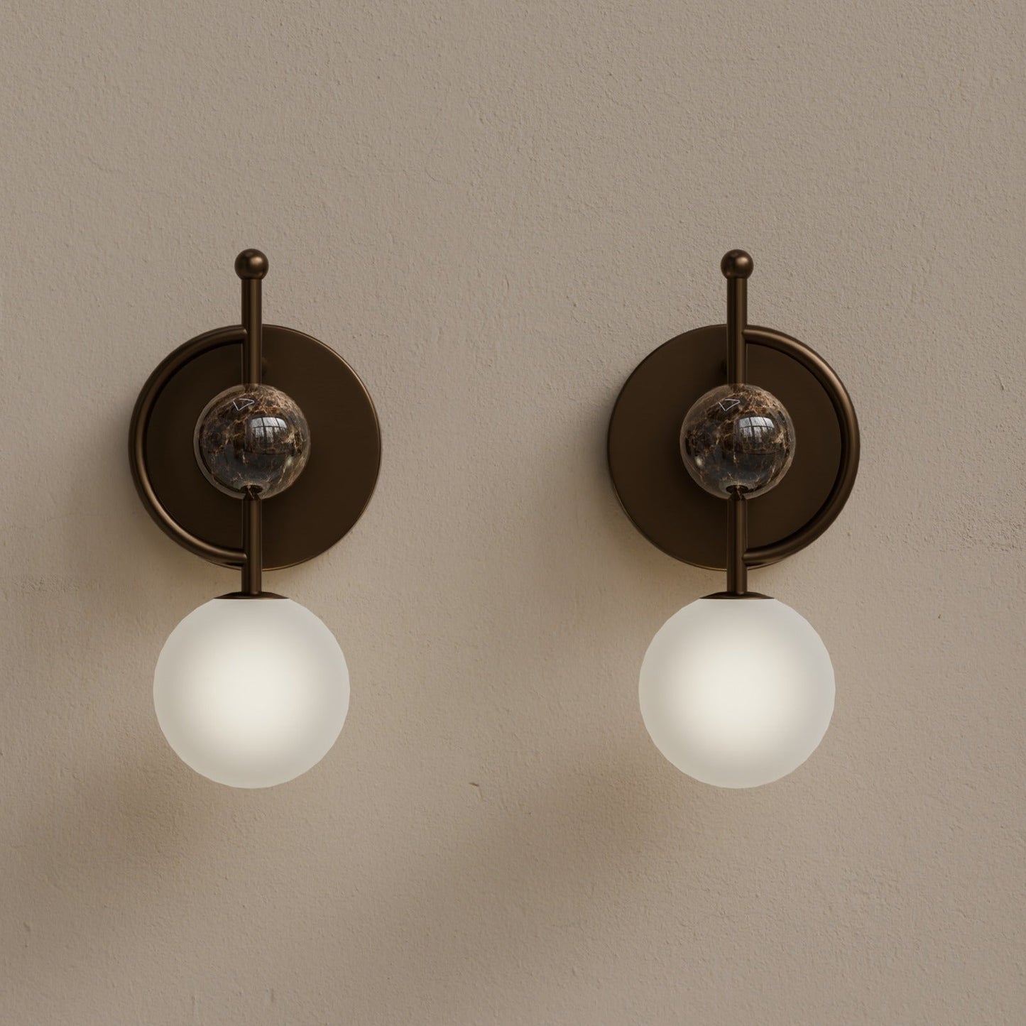 Front view of handmade marble wall sconce with frosted glass and dark bronze finish
