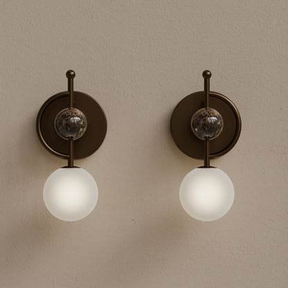 Front view of handmade marble wall sconce with frosted glass and dark bronze finish
