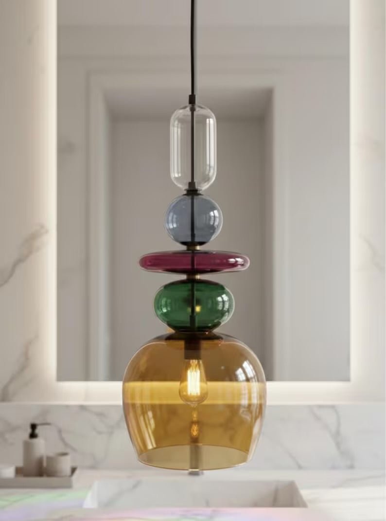 close up Multicolored pendant light in bathroom | Les Trois Pyramides