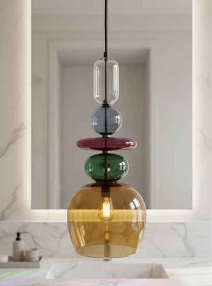 close up Multicolored pendant light in bathroom | Les Trois Pyramides