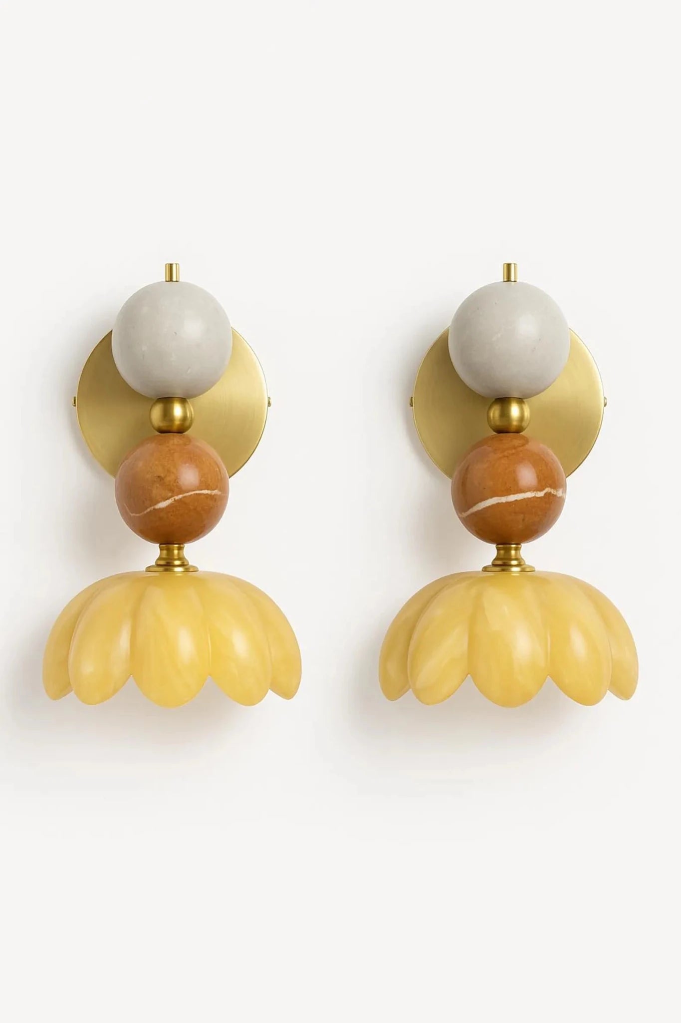 Pair of decorative wall sconces with gold, brown, and white design on a white background