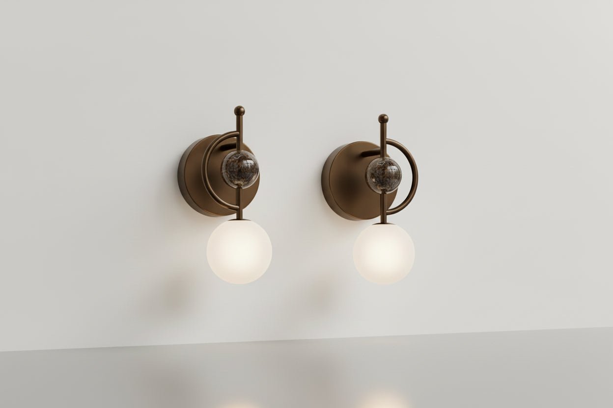 Close-up detail of marble stone and dark bronze metal wall sconce
