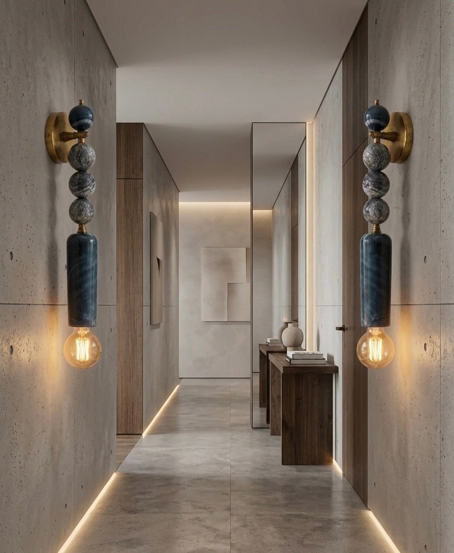 Modern hallway with decorative Marble wall lights and a console table - Les Trois Pyramides