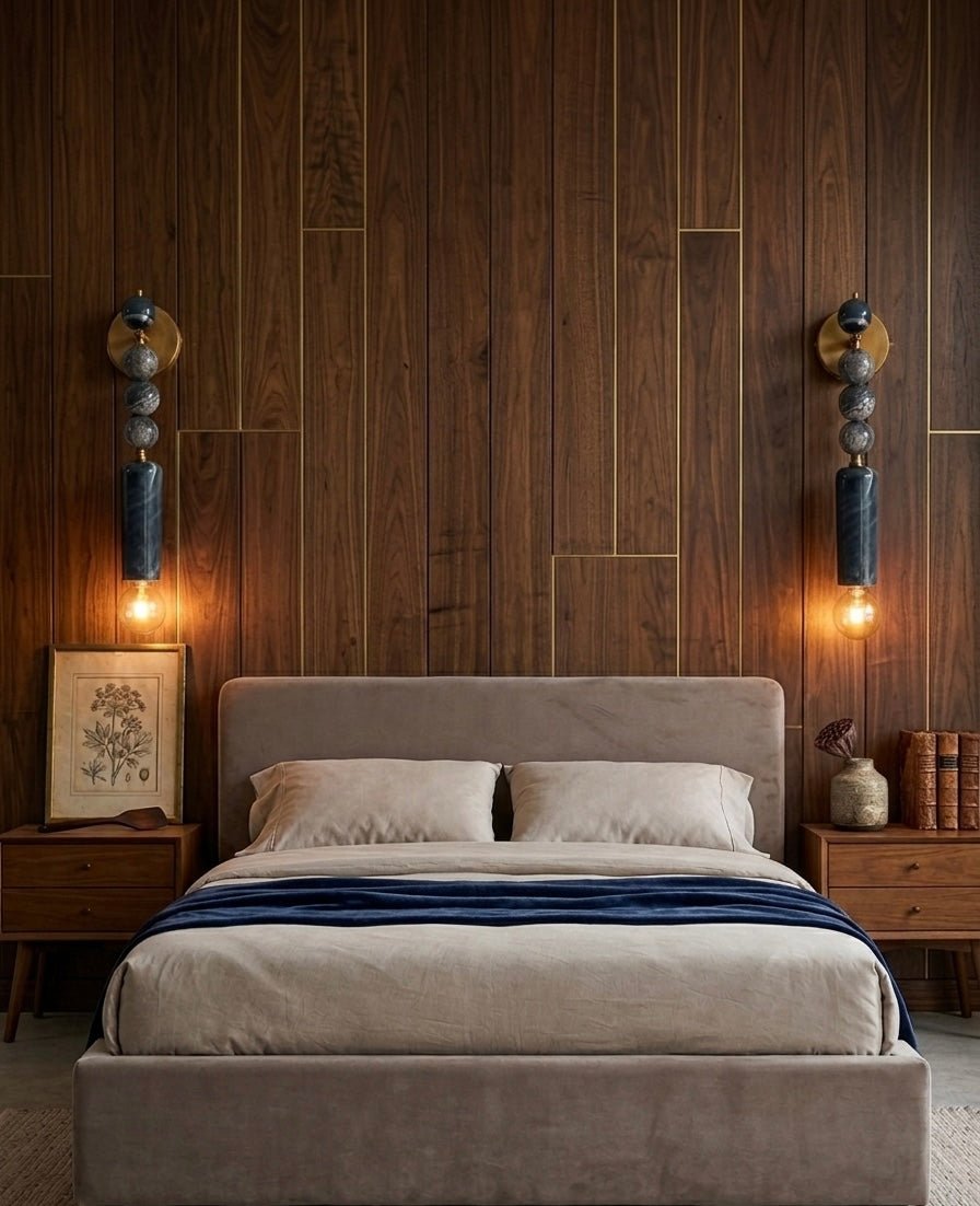 Bedroom with wooden wall paneling, bed, and Modern Marble wall sconces - Les Trois Pyramides