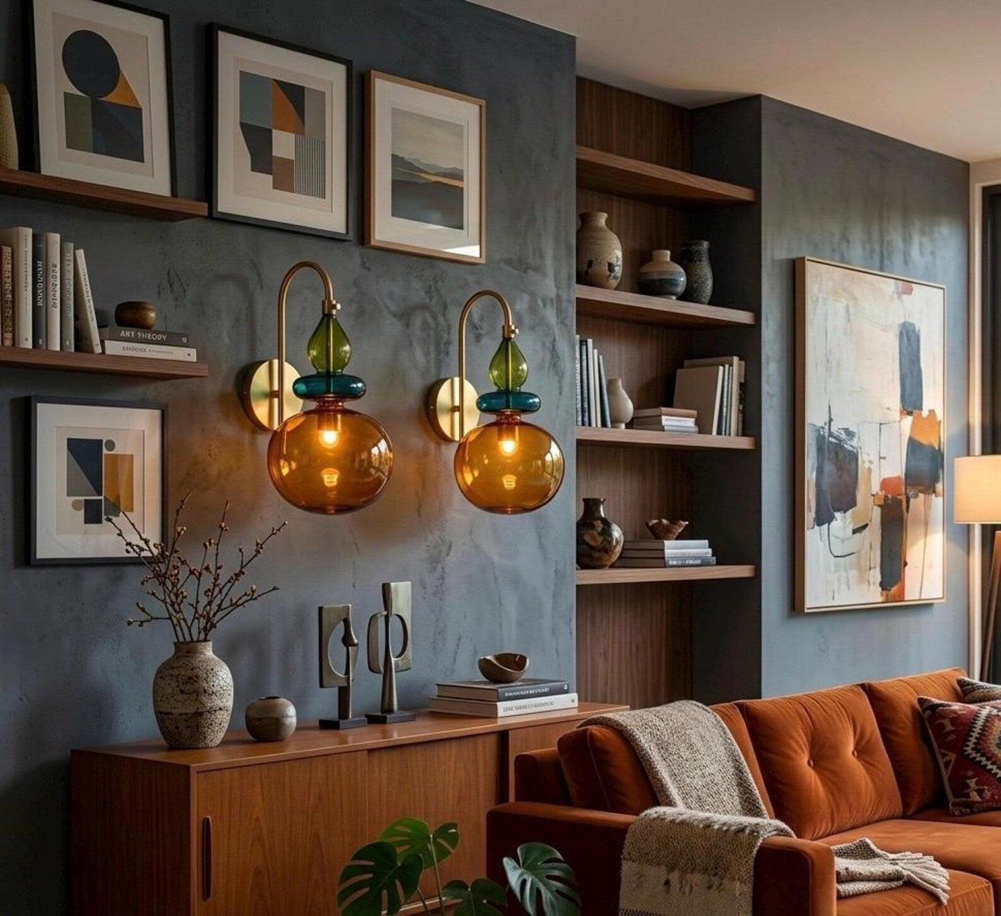 Modern living room with orange sofa, bookshelf, and wall art