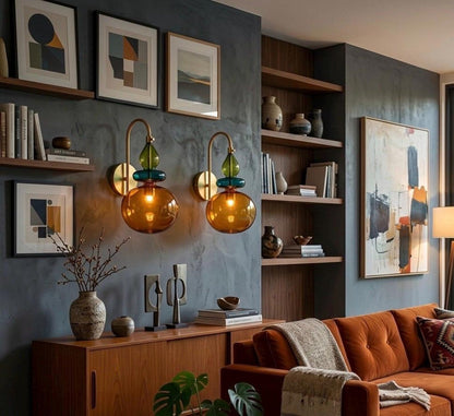 Modern living room with orange sofa, bookshelf, and wall art