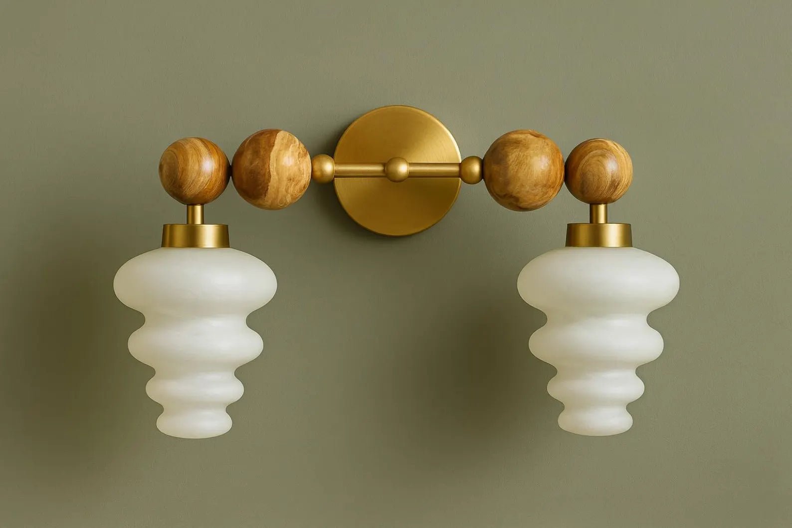 Wall-mounted light fixture with wooden and gold accents on a green wall.