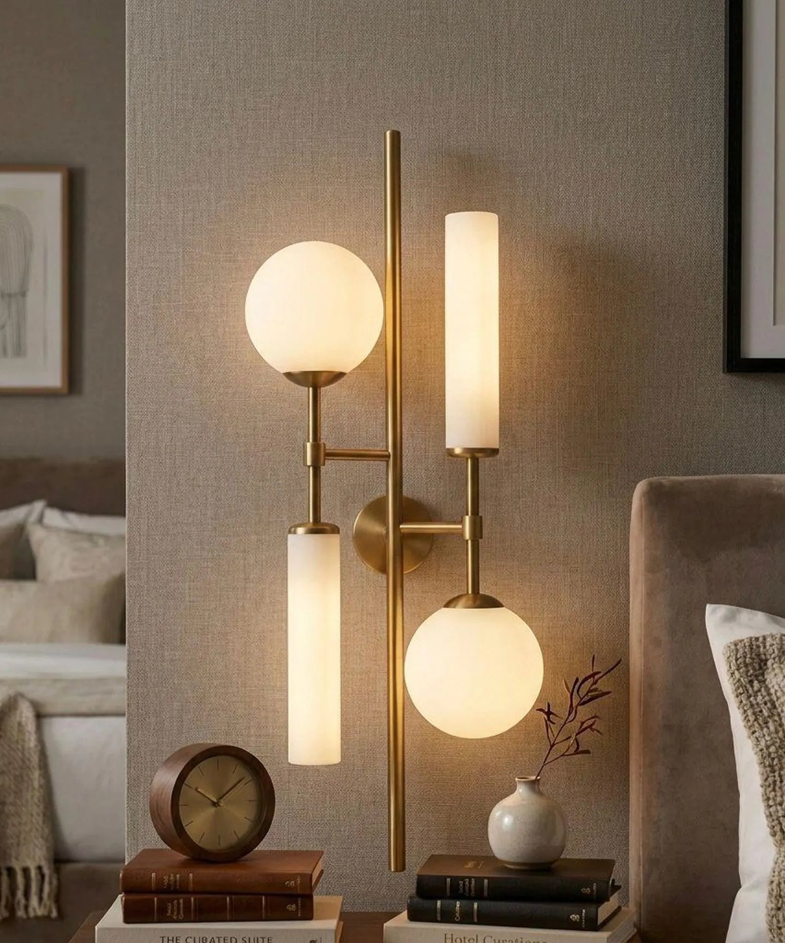 Modern wall-mounted lamp with glass shades in a living room setting.