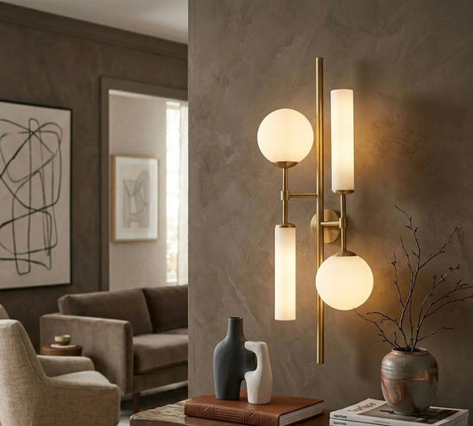 Modern wall sconce with spherical lights in a living room setting.