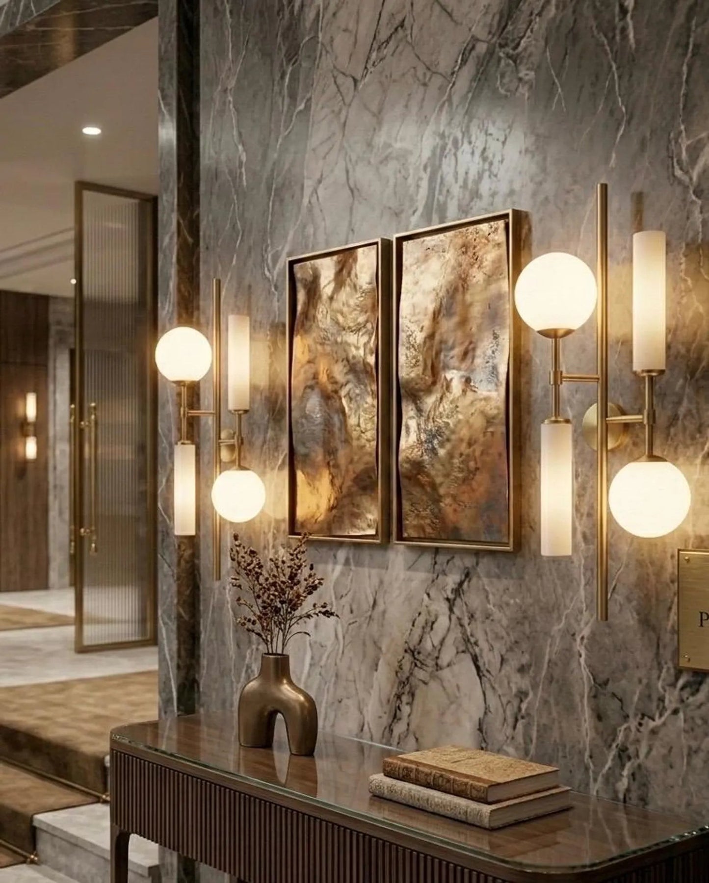 Decorative wall sconces with gold frames and marble wall in a stylish interior setting.