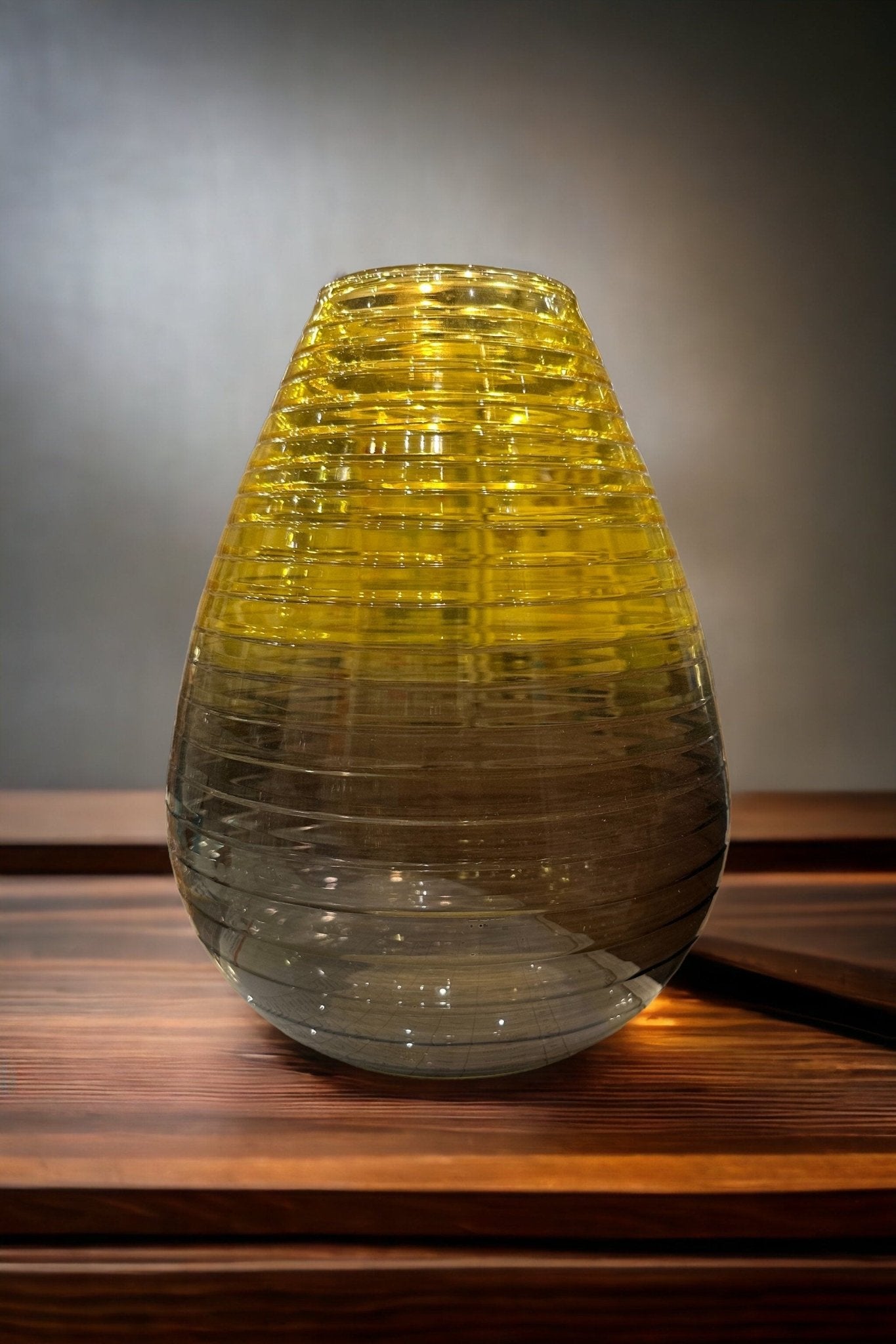 Modern Glass vase with Grading yellow and black colors on wooden table | Les Trois Pyramides